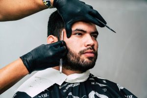 a man at a barber - Darren Yaw Wife